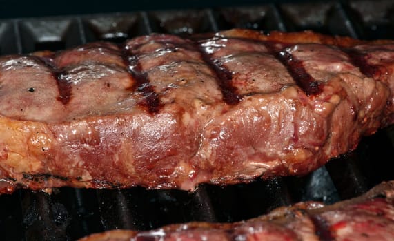 Close up of fillet steak in barbecue grill
