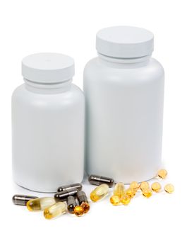 Pills and two bottle on the white