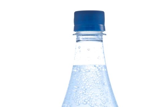 Bottle of water with bubbles on white background