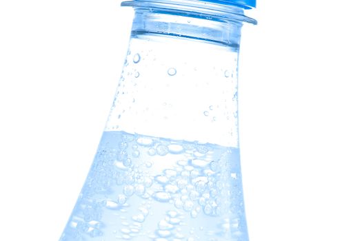 Bottle of water with bubbles on white background