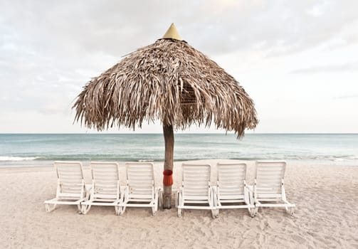 Chairs and umbrella on a sandy beach