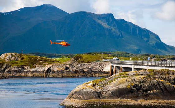 Red helicopter over Atlantic Road, Norway