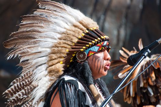 OSLO, NORWAY - JULY 18: Native American Indian tribal group play music, sing and dance to entertain shoppers in Oslo, Norway on July 18 2010