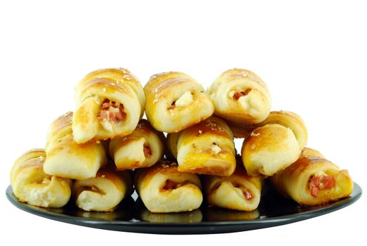 Fresh salt croissant on black dish