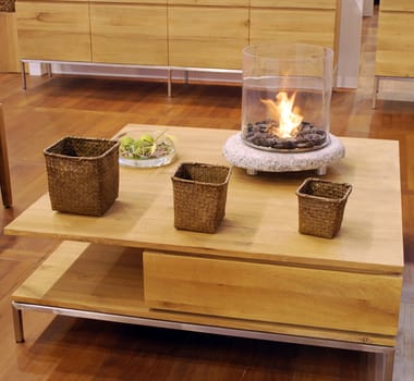 Living room with wooden table and fire decoration