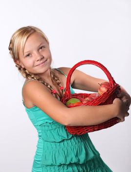 Beautiful girl with a basket of  Apples