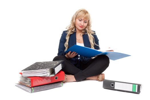 Beautiful girl sitting on the floor with folders for documents. Isolate on white background.