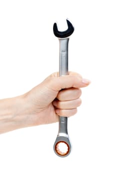 Woman's hand holding a chrome wrench. Isolate on white.
