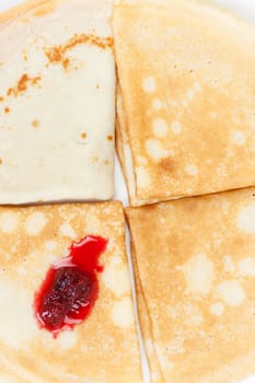 Fresh hot pancakes with raspberry jam
