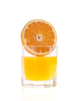 Glass of orange juice, and orange on white background