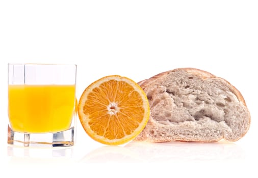 Glass of orange juice, orange and bread on white background