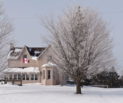 Countryside house in Canada, winter landscape