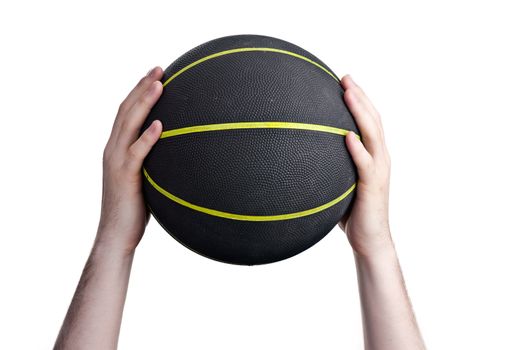 close up of player holding basketball in the air
