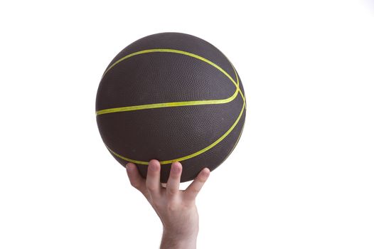 close up of player holding basketball in the air