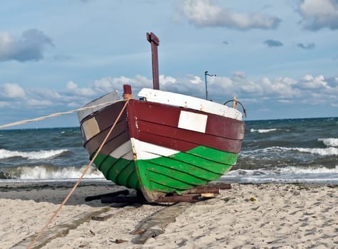 Abondoned fisherman boat on the shore of Baltic sea