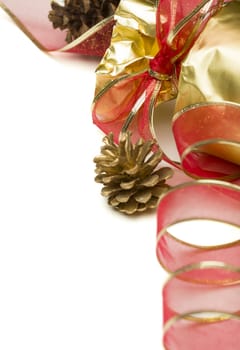 Christmas Present with Ribbon and Pine Cones on a White Background.