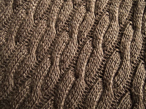 Knitted fabric - macro of a brown woolen texture