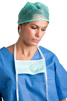 Sad Female Surgeon in scrubs, looking down