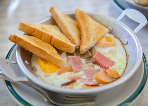eggs and toast breakfast on old plate