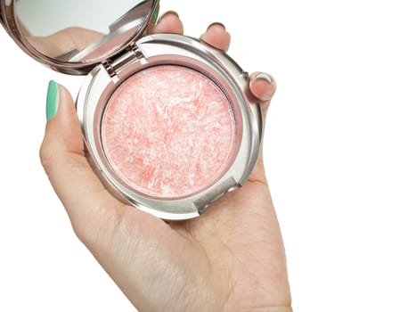 Cosmetic powder and hand, closeup