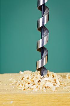 Wood drill bit with shaving