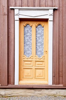Old ornate wooden door in Norway