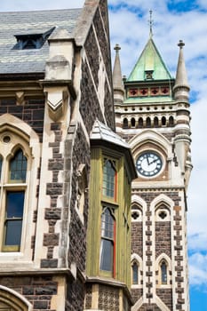 University of Otago Registry Building detail with clocktower in background, Dunedin, New Zealand