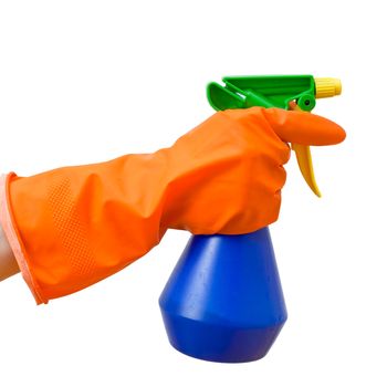Hand in orange protective glove holding blue spray bottle on white background