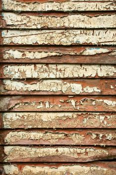 Weathered wooden wall with peeling paint background