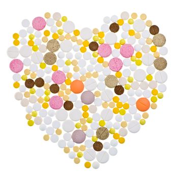 Various tablets in the shape of a heart on white background