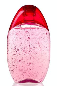 Crimson transparent shampoo bottle on white background