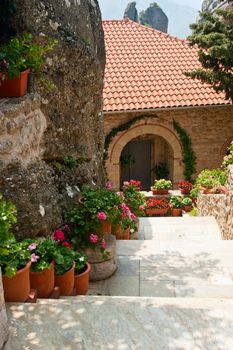Potted flowers along the stairs at Greek monastery
