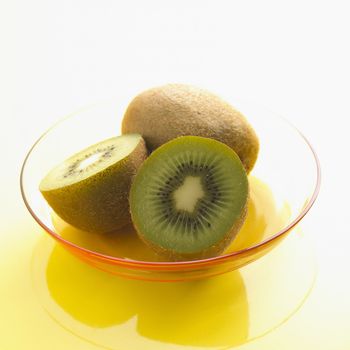 Halved and Whole Kiwi Fruit