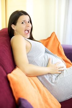 Good looking pregnant woman shouting scared