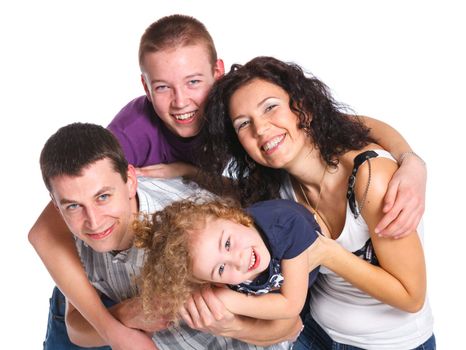 Portrait of beautiful smiling happy family of four - isolated over a white background