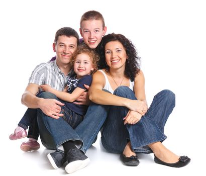 Beautiful smiling happy family of four - isolated over a white background