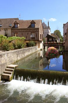 city ​​on the water with flowers, bridges and medieval houses medieval