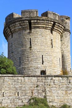 fortifications, tower and tower of a castle on blue sky background