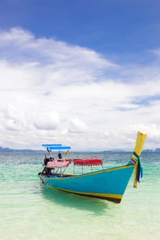 Long Tail Boat at tropical White Sand Beach Trang near Phuket Thailand