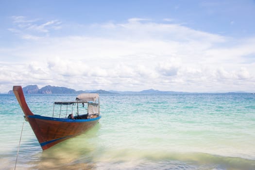 Long Tail Boat at tropical White Sand Beach Trang near Phuket Thailand