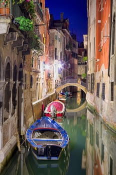 boats and water near buildings of Venice, Italy. Night scene