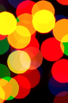 The abstract colorful christmas lights as background