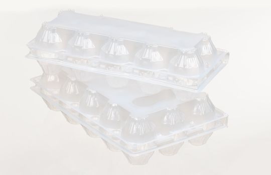 Empty plastic box for eggs on white background