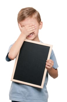 Portrait of a little boy holding a blackboard over white background