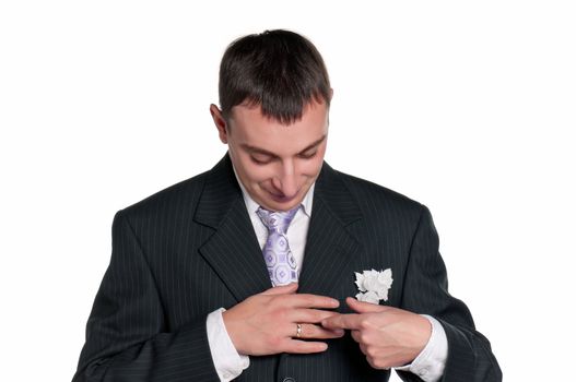 Portrait of happy groom on white background