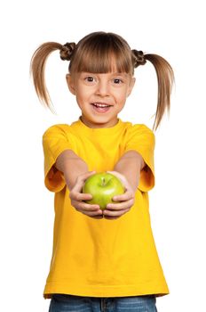 Portrait of happy little girl with apple isolated on white background