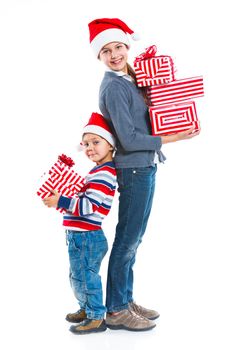 Smiling little boy and his sister in Santa's hat with gift box, isolated on white