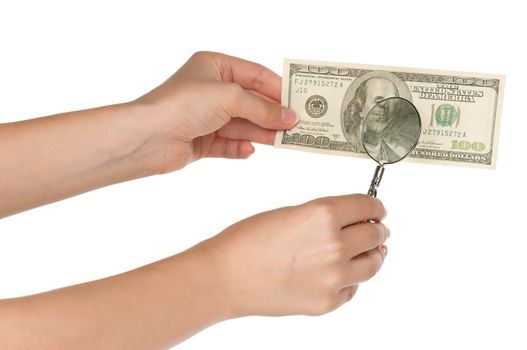 Woman hands with magnifying glass and dollars isolated on white background