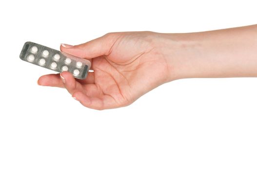 Pills in woman hand isolated on white background