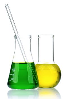 Laboratory glassware with colorful liquids on white background